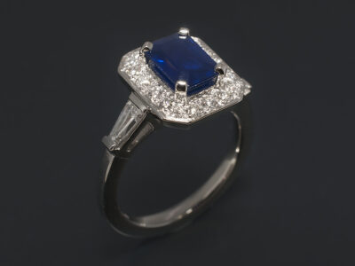 Ladies Sapphire and Diamond Halo Dress Ring, Platinum Claw and Pavé Set Design, Emerald Cut Sapphire 1.21ct, Round Brilliant Cut Lab Grown Diamonds approx. 0.40ct, Tapered Baguette Cut Lab Grown Diamonds 0.26ct (2), F Colour, VS Clarity Minimum