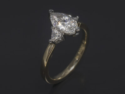 Ladies Trilogy Diamond Engagement Ring, Platinum and 18kt Yellow Gold Claw Set Design, Marquise Cut Diamond 0.90ct, E Colour, VS2 Clarity, Trilliant Cut Diamond Side Stones 0.14ct (2)
