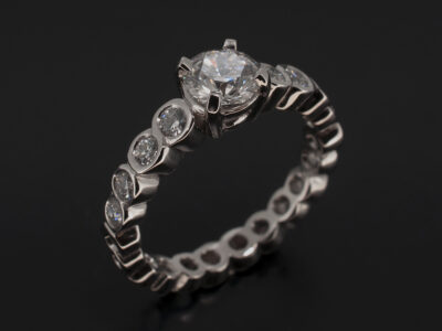 Ladies Diamond Engagement Ring, Platinum Claw and Rub over Set Design, Round Brilliant Cut Lab Grown Diamond 0.70ct, D Colour, VS1 Clarity, Round Brilliant Cut Lab Grown Diamond Shoulder