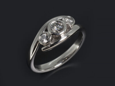 Ladies Diamond Trilogy Engagement Ring, Platinum Rub over Set Twist Design, Customers own Round Brilliant Cut Diamond 0.33ct, Round Brilliant Cut Diamond Sides 0.22ct (2)
