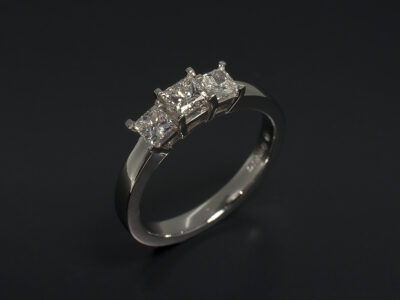 Ladies Diamond Trilogy Engagement Ring, Platinum Shared Claw Design, Princess Cut Diamonds 0.30ct, F Colour, VS1 Clarity, Princess Cut Side Diamonds 0.38ct Total