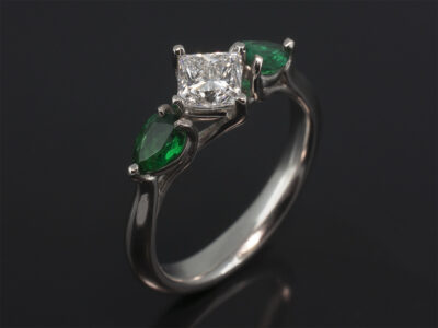Ladies Diamond and Emerald Trilogy Engagement Ring, Platinum Claw Set Design, Princess Cut Diamond 0.62ct, E Colour, VS1 Clarity, Pear Shape Emeralds 0.44ct (2)