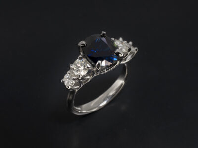Ladies Sapphire and Diamond Dress Ring, Platinum Claw Set Crossover Design, Customers Own Oval Cut Sapphire 3.49ct, Round Brilliant Cut Diamonds x3; 0.16ct, 0.14ct, 0.38ct