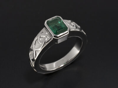 Ladies Solitaire Emerald Ring, Platinum Rub over Set Design, Emerald Cut Emerald 1.10ct, Celtic Pattern Detail Band