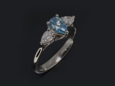 Ladies Blue Diamond Trilogy Engagement Ring, Platinum Claw Set Design, Pear Shape Blue Treated Lab Grown Diamond 0.62ct, VS2 Clarity, Pear Shape Lab Grown Diamond Sides 0.42ct (2)