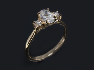 Ladies Trilogy Diamond Engagement Ring, 14kt Yellow Gold Claw Set Design, Oval Cut Diamond 0.50ct, F Colour, SI1 Clarity, VG Polish, Good Symmetry, Round Brilliant Cut Diamond Sides 0.16ct (2)