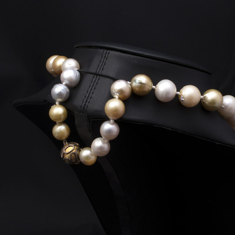 South Sea pearl necklace in peach and grey with gold and silver decorative magnetic clasp