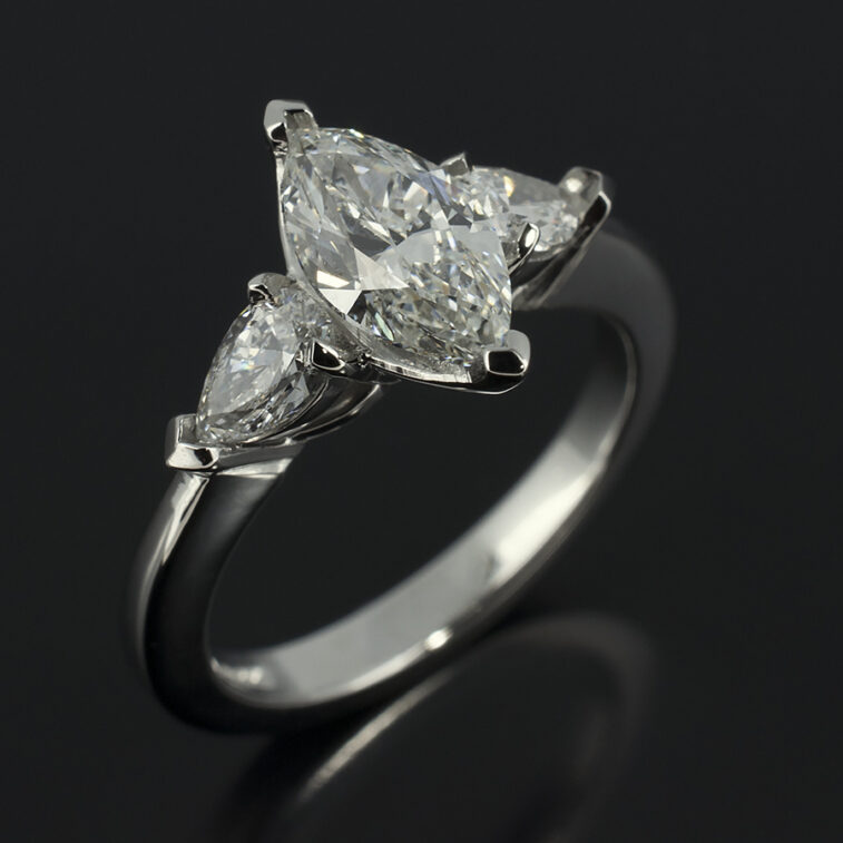 Ladies Trilogy Diamond Engagement Ring, Platinum Claw Set Design, Marquise Cut Diamond Centre Stone 0.90ct, F Colour, SI1 Clarity, Pear Cut Diamond Side Stones 0.40ct (Total)