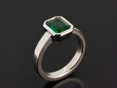 Ladies Solitaire Emerald Engagement Ring, Platinum Rub over Set Design, Octagon Cut Emerald 1.40c