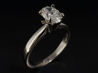 Ladies Solitaire Diamond Engagement Ring, Platinum Claw Set Design, Oval Cut Diamond, 0.81ct.