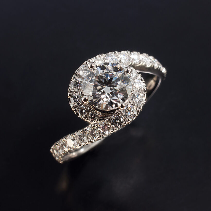 Round Brilliant Cut Lab Grown Diamond Ring with Diamond Set Halo and Shoulders, Compass Set Twist Design in Platinum
