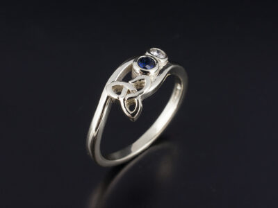 Ladies Sapphire and Diamond Celtic Dress Ring, 9kt White Gold Rub over Set Design, Round Cut Blue Sapphire, Round Brilliant Cut Lab Grown Diamond 0.07ct, Trinity Knot Detail, Un-rhodiumed Finish