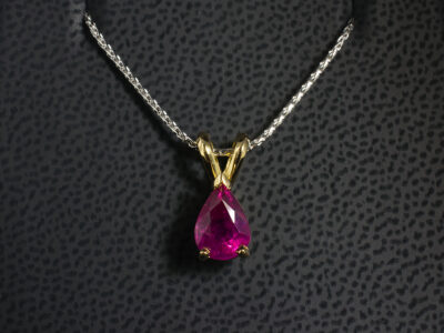18kt Yellow Gold Claw Set Ruby Pendant, Pear Cut Ruby 1.78ct, Double Bale Detail on a Contrasting 18kt White Gold Spiga Chain