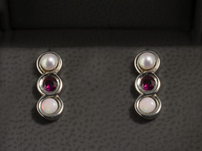 9kt White Gold Rub over Set Infinity Design Stud Earrings, Round Cut Rubies, Opals and Pearls