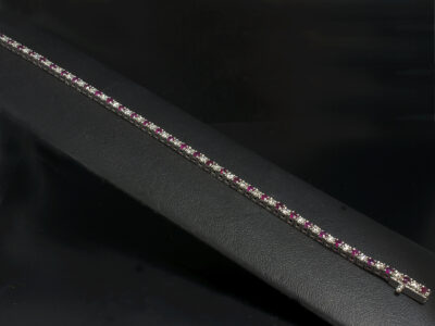 Ladies 18kt White Gold Diamond and Ruby Claw Set Tennis Bracelet, Round Brilliant Cut Diamonds 1.15-1.20ct and Round Cut Rubies 1.40-1.50ct, 7 Inches