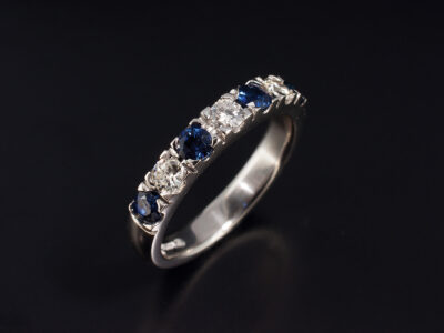 Ladies Blue Sapphire and Diamond Eternity Ring, Platinum Castle Set Design, Round Cut Sapphires 0.61ct Total (4), Round Brilliant Cut Diamonds 0.26ct Total (3)