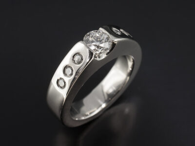 Ladies Contemporary Diamond Engagement Ring, Platinum Partial Rub over and Secret Set Design, Round Brilliant Cut Diamond 0.50ct, Round Brilliant Cut Diamond Shoulders 0.18ct Total (6)