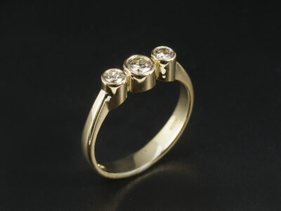 Ladies Diamond Trilogy Engagement Ring, 18kt Yellow Gold Rub over Set Design, Round Brilliant Cut Diamonds