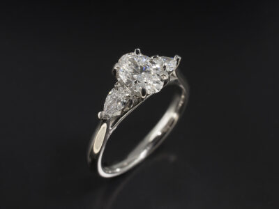 Ladies Lab Grown Diamond Trilogy Engagement Ring, Platinum Claw Set Lattice Design, Oval Cut Lab Grown Diamond 0.72ct, Pear Cut Lab Grown Diamonds 0.20ct Total (2)