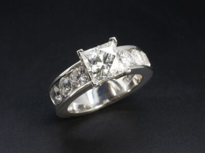 Ladies Princess Cut Diamond Engagement Ring, Platinum Claw and Channel Set Design, Princess Leo Cut Diamond 1.96ct, Round Brilliant Cut Diamonds 1.31ct Total (6)