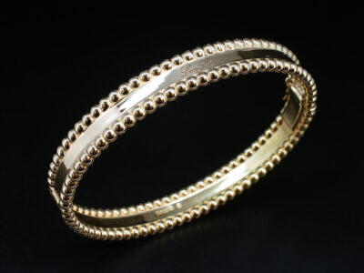 Ladies 18kt Yellow Gold Solid Bangle, Hinge Opening with Circular Edge Detailing, Polished Finish