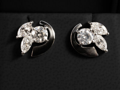 Platinum Claw Set Diamond Stud Earrings, 3 Stone Design with Metal Detailing, Round Brilliant Cut Diamonds 1.00 ct Total (2), Marquise Cut Diamonds 0.96ct Total (4)