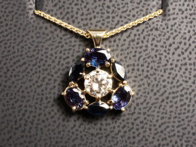 18kt Yellow Gold Claw Set Pendant with Diamond and Coloured Stones, Round Brilliant Cut Diamond 0.92ct, Oval Cut Alexandrites 1.30ct Total (3), Marquise Cut Blue Sapphires 0.89ct Total (3)