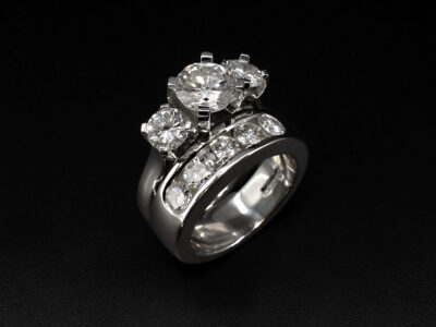 Ladies Diamond Trilogy Engagement Ring, Platinum Claw Set Design, Round Brilliant Cut Diamonds, Shown with Matching Channel Set Wedding Ring