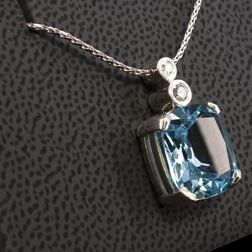 Cushion Cut Topaz Pendant, Claw Set in White Gold with a Decorative Diamond Set Bale