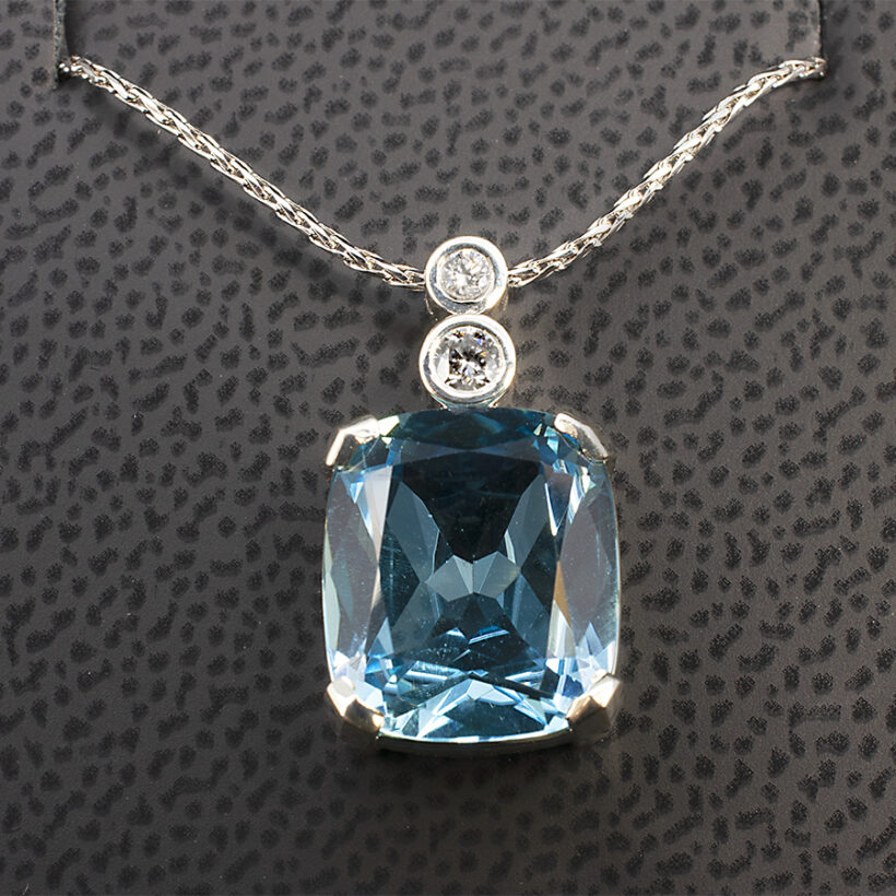 Cushion Cut Topaz Pendant, Claw Set in White Gold with a Decorative Diamond Set Bale-front