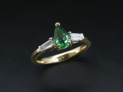 Ladies Emerald and Diamond Trilogy Engagement Ring, Platinum and 18kt Yellow Gold Claw and Bar Set Design, Pear Shaped Emerald 0.85ct, Tapered Baguette Cut Diamonds 0.36ct