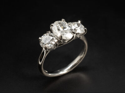 Ladies Lab Grown Diamond Trilogy Engagement Ring, Platinum Claw Set Lattice Design, Oval Cut Lab Grown Diamond 1.21ct, Round Brilliant Cut Lab Grown Diamonds 0.61ct, 0.60ct