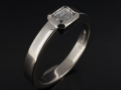 Ladies Solitaire Diamond Engagement Ring, Platinum Rub over Set Design, Emerald Cut Diamond 0.52ct