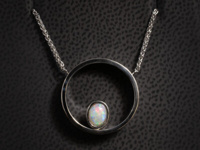 Platinum Circle Pendant, Rub over and Pavé Set Design with Oval Cut Opal 0.32ct, Eight Cut Diamond 0.01ct