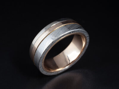 Gents Bespoke Damascus Steel Wedding Ring, 9kt White and Red Gold Design Hemskringla Damascus Steel Pattern
