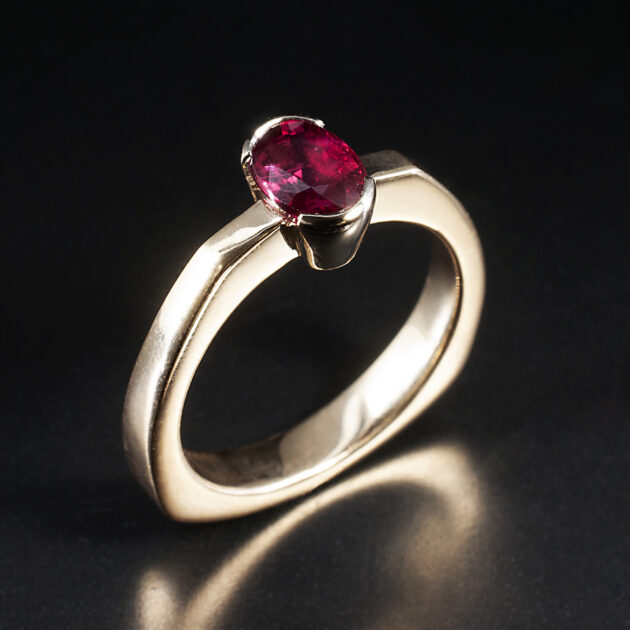 Ladies Solitaire Ruby Ring, 9kt Rose Gold with Platinum Part Rub over Setting, Angled Shoulder Detail, Oval Cut Ruby 1.07ct 6x8.5mm