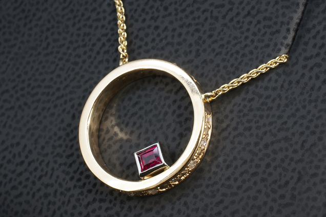 Bespoke diamond and ruby halo pendant by Blair and Sheridan Glasgow