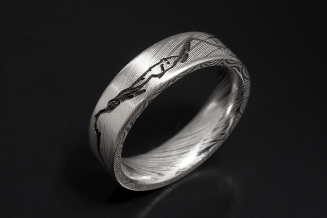 Bespoke damascus steel wedding ring with Scottish landscape by Blair and Sheridan