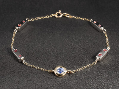 Ladies Sapphire and Ruby Bracelet, 9kt Yellow Gold and 18kt White Gold Rub over and Secret Set Design, Round Cut Sapphire 0.21ct, Round Cut Rubies 0.42ct Total (16)