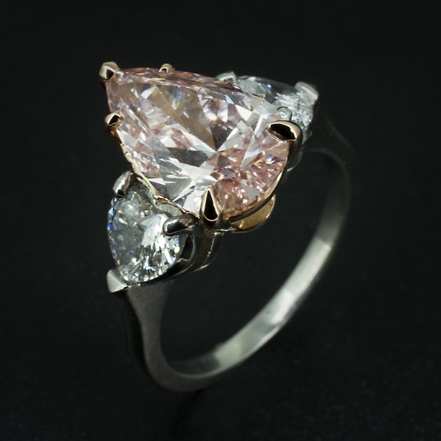 Pear Cut Pink Diamond and Heart Shape White Diamond Trilogy Design Engagement Ring in Platinum and Rose Gold