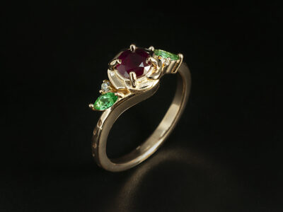 Ladies Ruby Engagement Ring, 18kt Rose Gold Claw Set Floral Twist Design, Round Brilliant Cut Ruby 0.56ct, Marquise Cut Emerald 0.22ct Total (2), Round Brilliant Cut Diamonds 0.03ct Total (2)