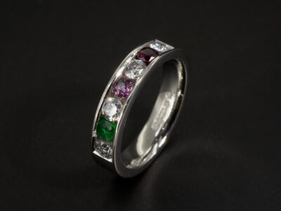 Ladies Diamond and Coloured Stone Dress Ring, Platinum Channel Set Design, Round Brilliant Cut Diamonds 0.40ct Total, Round Brilliant Cut Garnet, Ruby and Emerald