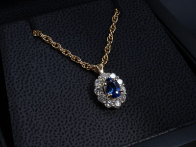 9kt White and Yellow Gold Sapphire and Diamond Pendant, Claw Set Cluster Design, Oval Cut Blue Sapphire 0.94ct, Round Brilliant Cut Diamonds 0.74ct (10) 
