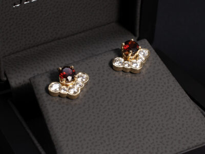9kt Yellow Gold Diamond and Garnet Studded Earrings, Claw and  Rub over Set Halo Design, Round Brilliant Cut Diamonds 0.58ct Total (10), Round Deep Red Garnets 0.72ct (2) 