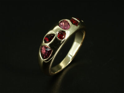 Ladies Pink Garnet Dress Ring, 9kt Yellow Gold Secret Set Design, Scattered Pink Garnets 0.92ct Total (6), Marquise, Princess, Oval, Round, Pear and Trilliant Cut Stones