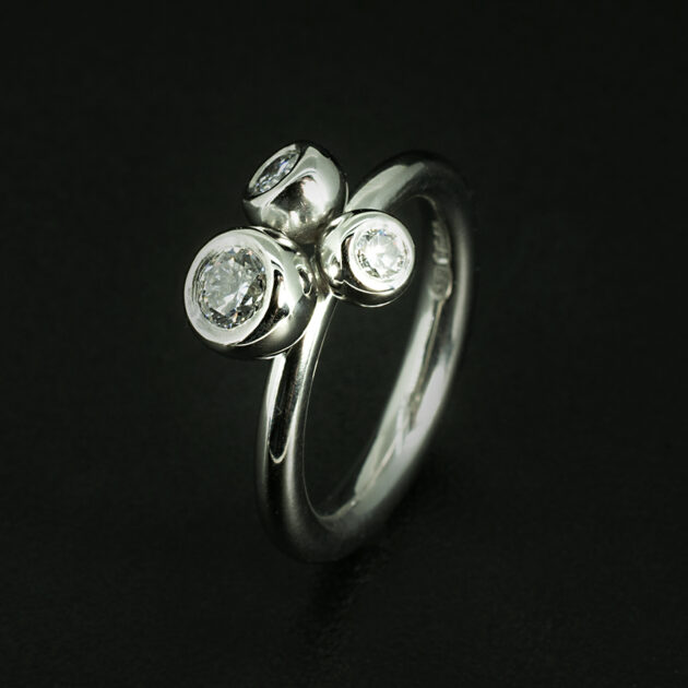 Kelvin Collection Platinum and Diamond Trilogy Ring Featuring Three Round Brilliant Cut Diamonds by Blair and Sheridan