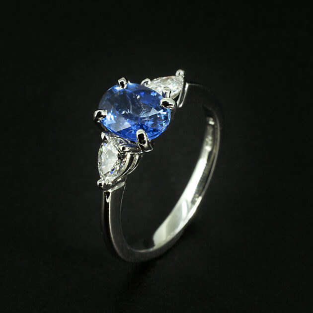 Bespoke Platinum Sapphire and Diamond Trilogy Ring – 1.63ct Oval Blue Sapphire with Pear Cut Diamonds