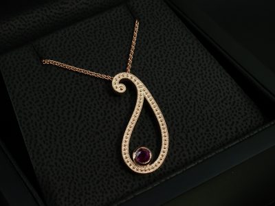 9kt Rose Gold Paisley Pattern Ruby Pendant, Rub over Set Design, Round Cut Ruby 0.48ct