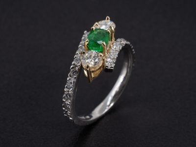 Ladies Emerald and Diamond Dress Ring, Platinum and 18kt Yellow Gold Claw and Castle Set Design, Oval Cut Emerald 0.51ct, Round Brilliant Cut Diamonds 0.44ct (2), 0.36ct (16), 0.08ct (4) 