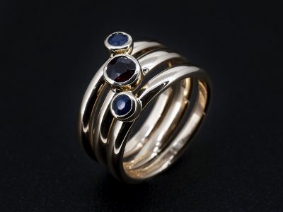 Ladies Coloured Stone Stacking Dress Ring, 9kt Yellow Gold Rub over Set Design, Round Cut Ruby (1), Round Cut Sapphires (2)